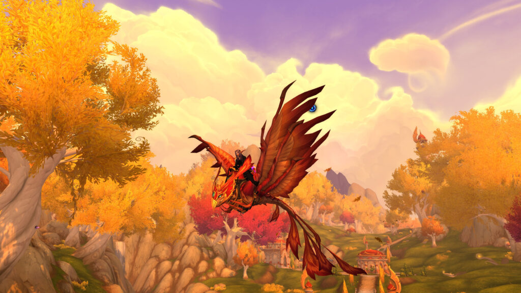 A red phoenix soaring over autumn hills at sunset