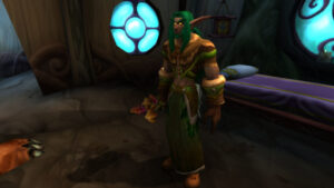 A night elf resting in a lantern-lit home